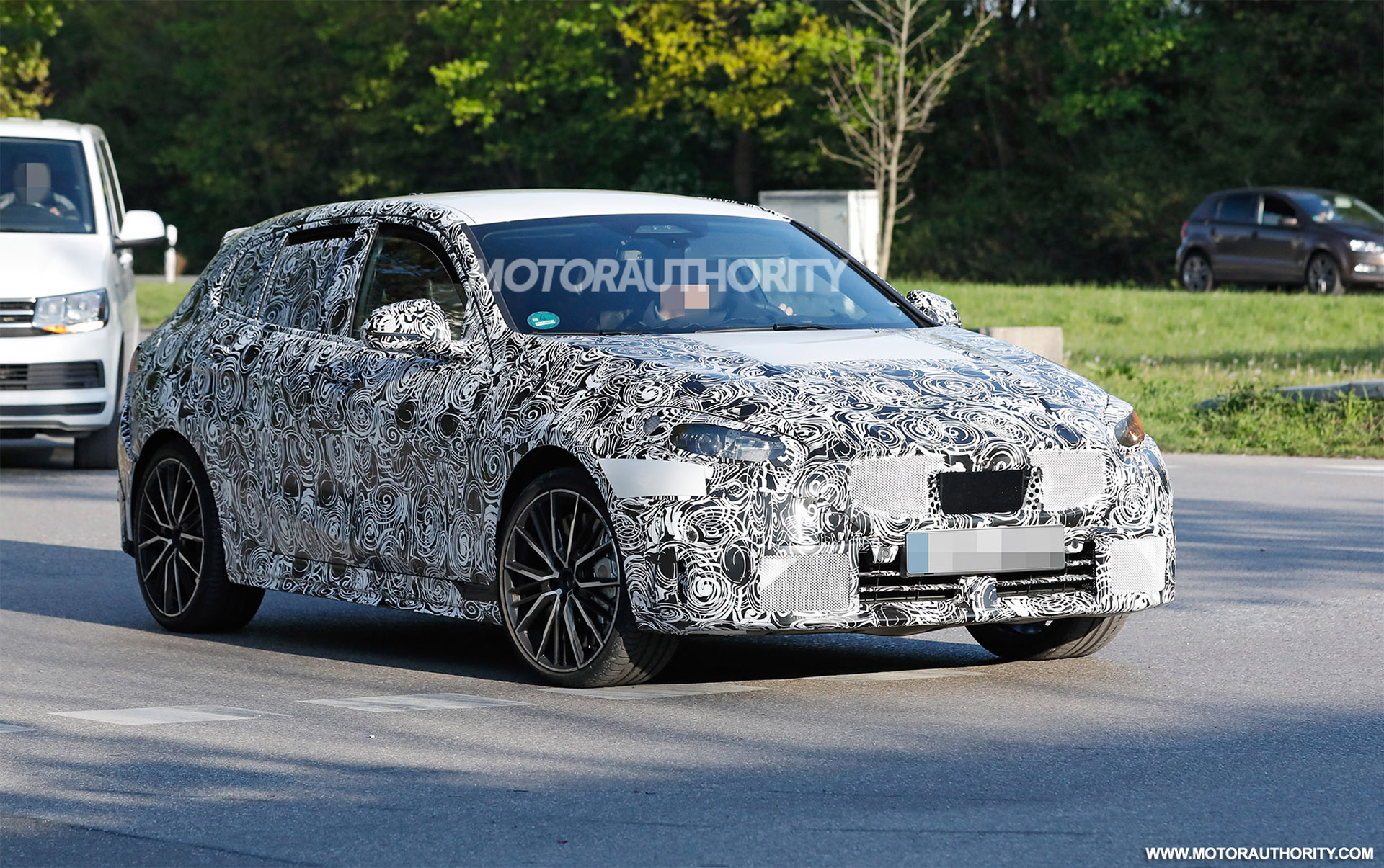 1651573207 2023 BMW M135i Hatchback spy shots Tweaked hot hatch spotted