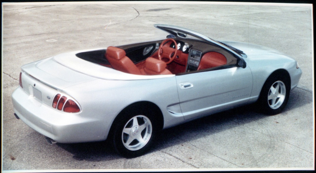 This convertible version of a 1994 Mustang theme had a hard cover over the folded top and a bold red interior. You can also see the dual cockpit intake was very far along in development at this point. This is one of the first concepts to feature tri-bar taillamps, in this case in the traditional vertical arrangement (Image courtesy of Ford Motor Company)