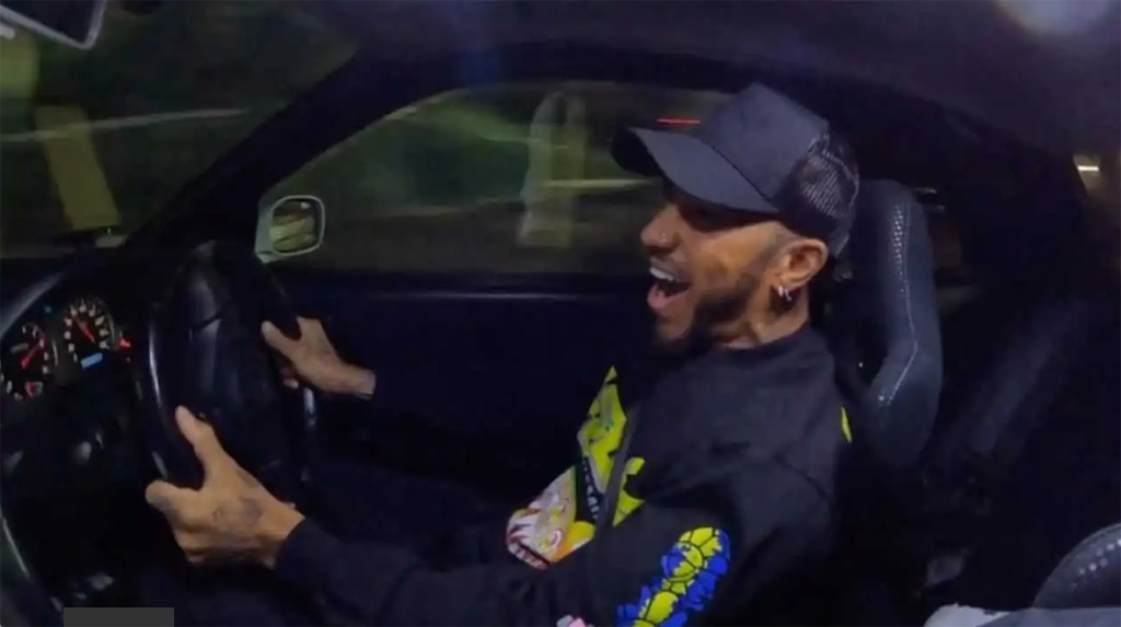 Lewis Hamilton hoons an R34 Nissan Skyline GT R in Japan