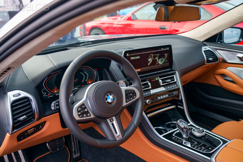 The interior of the BMW 8 Series highlights analog controls and the classic iDrive layout before digital transformation