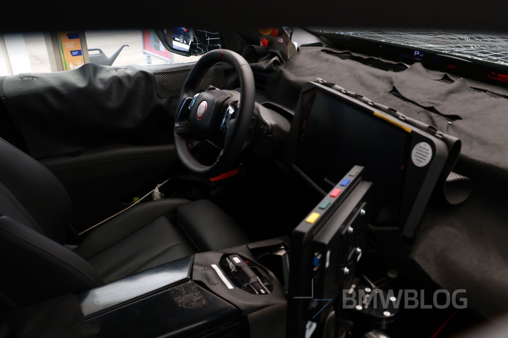 Close-up view of the 2027 BMW X5 interior showcasing the panoramic iDrive display and redesigned dashboard layout