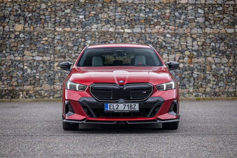 BMW i5 tour in Fire Red
