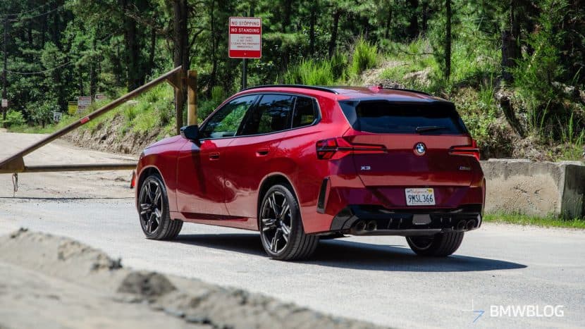 2025 BMW X3 M50 FIRE RED three-quarter rear