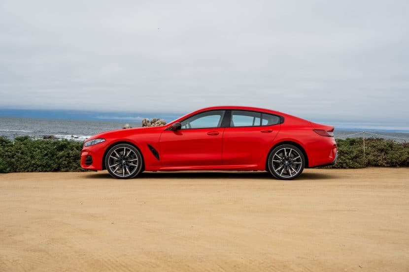 2026 BMW M850i HERATITE BRIGHT RED SIDE VIEW PARKET