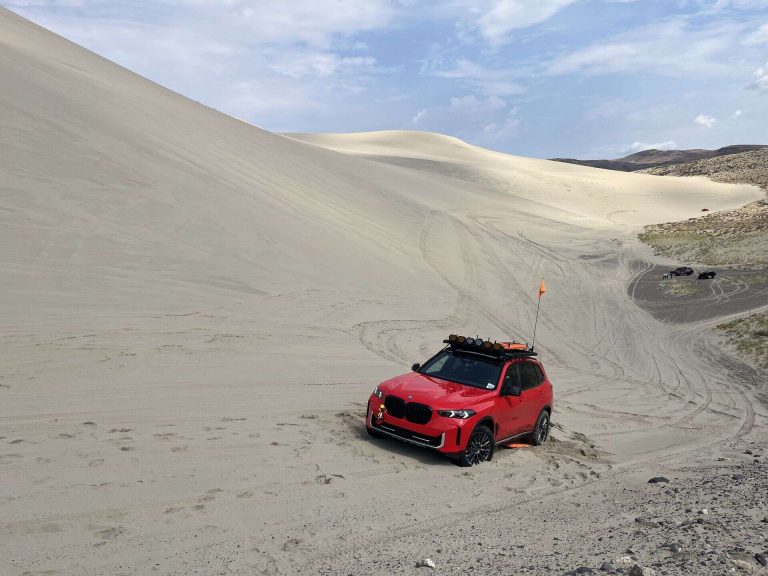 BMW X5 xDrive40i competing in the 2025 Rebelle Rally across California and Nevada desert terrain.