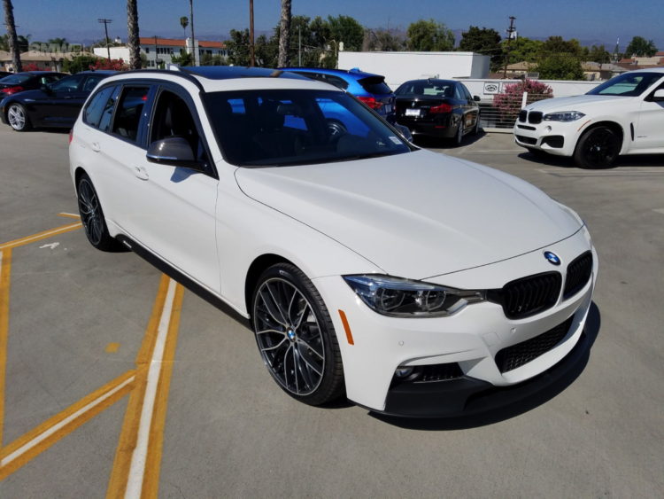 BMW 328d Sports Wagon with white exterior, elegant design and sporty details.